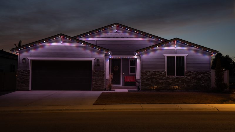 String lighting over a backyard pool